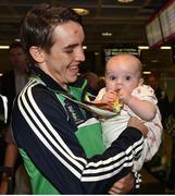 16 August 2015; Ireland gold medal winner Michael Conlan, Bantam weight, with his daughter Luisne, age 5 months, at the Ireland team's homecoming from the EUBC Elite European Boxing Championships. Dublin Airport, Dublin. Picture credit: Cody Glenn / SPORTSFILE
