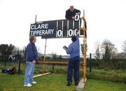 25 January 2009; Groundsmen Pat Rice, right, Brian O'Neill, left, and Michael Bryan construct the scoreboard before the game. Waterford Crystal Cup Hurling Final, Clare v Tipperary, Ogonnolloe, Co. Clare. Picture credit: Pat Murphy / SPORTSFILE