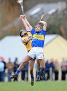 25 January 2009; Brendan Bugler, Clare, in action against James Woodlock, Tipperary. Waterford Crystal Cup Hurling Final, Clare v Tipperary, Ogonnolloe, Co. Clare. Picture credit: Pat Murphy / SPORTSFILE
