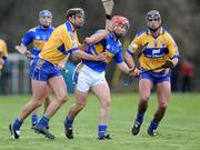 25 January 2009; Diarmaid Fitzgerald, Tipperary, in action against Tony Griffin and Brendan Bugler, right, Clare. Waterford Crystal Cup Hurling Final, Clare v Tipperary, Ogonnolloe, Co. Clare. Picture credit: Pat Murphy / SPORTSFILE