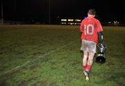 24 January 2009; Cork captain Conor McCarthy makes his way to the dressing room with the cup after the match. McGrath Cup Football Final, Cork v University of Limerick. Pairc Ui Rinn, Cork. Picture credit: Brian Lawless / SPORTSFILE
