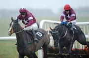 29 January 2009; Sun Tzu, 13, with Davy Russell up, on their way to winning the www.thurlesraces.ie Maiden hurdle after jumping the last from second place Madman, with Shane Jackson up. Thurles Racecourse, Thurles, Co. Tipperary. Picture credit: Matt Browne / SPORTSFILE