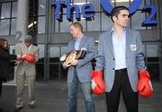29 January 2009; Bernard Dunne, right, and boxing promoter Brian Peters wait as WBA Super Bantamweight title holder Ricardo &quot;El Maestrito&quot; Cordoba receives some assistance with his gloves after a press conference to announce details of their Hunky Dorys World Title Fight Night on March 21st at the O2 arena, as world championship boxing returns to Ireland for the first time in 13 years. The O2, Dublin. Picture credit: Brian Lawless / SPORTSFILE