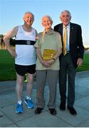 18 August 2015; Tommy Hayward, centre, a long-time Donore Harriers member, pictured with Frank Greally, left, after being presented with Ronnie Delany's book &quot;Staying The Distance&quot; from Ronnie Delany, right, Irish Olympic 1500m gold medallist. Frank Greally's Gratitude Run. Morton Stadium, Dublin.  Picture credit: Cody Glenn / SPORTSFILE