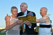 18 August 2015; Ron Hill, left, a former English Olympic distance runner, is presented with Ronnie Delany's book &quot;Staying The Distance&quot; from Ronnie Delany, Irish Olympic 1500m gold medallist, centre, alongside Frank Greally, right. Frank Greally's Gratitude Run. Morton Stadium, Dublin.  Picture credit: Cody Glenn / SPORTSFILE