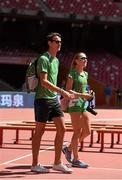 21 August 2015; Irish athletes Timmy Crowe, a member of the 4x400m relay team, and Kerry O'Flaherty, women's 3000m steeplechase, walk around the stadium ahead of the IAAF World Track & Field Championships at the National Stadium, Beijing, China. Picture credit: Stephen McCarthy / SPORTSFILE