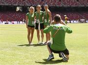 21 August 2015; Irish 3000m steeplechase athletes, from left, Michelle Finn, Sara Treacy and Kerry O'Flaherty have their picture taken by coach Paul McNamara ahead of the IAAF World Track & Field Championships at the National Stadium, Beijing, China. Picture credit: Stephen McCarthy / SPORTSFILE