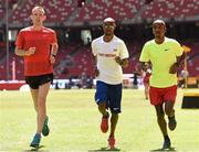 21 August 2015; Athletes, from left, Galen Rupp of the United States, Mo Farah of Great Britain and Bashir Abdi of Belgium ahead of the IAAF World Track & Field Championships at the National Stadium, Beijing, China. Picture credit: Stephen McCarthy / SPORTSFILE