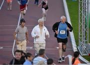 18 August 2015; Niall Matthews, 561, Maurice Timmons and Vinny Clohisey, left, follow Frank Greally, who set a record for the 10,000M 45 years ago on this day,  around Morton Stadium for 30.17 - the record time set on the night. Frank Greally's Gratitude Run. Morton Stadium, Dublin Picture credit: Ray McManus / SPORTSFILE