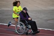 18 August 2015; Mary B. Jennings pushes Ray McBride for the last lap as Frank Greally, who set a record for the 10,000M 45 years ago on this day, runs around Morton Stadium for 30.17 - the record time set on the night. Frank Greally's Gratitude Run. Morton Stadium, Dublin Picture credit: Ray McManus / SPORTSFILE