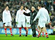 31 January 2009; Tyrone manager Mickey Harte speaks to his players as they wear 'retro playing kit' before the game. Allianz National Football League, Division 1, Round 1, Dublin v Tyrone, Croke Park, Dublin. Picture credit: Brendan Moran / SPORTSFILE