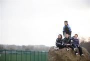 1 February 2009; Young race fans, Aaron Fitzpatrick, age 10, left, Jonathan Deane, age 10, Kevin Seery, age 11, right, and Christopher Brady, age 10, standing, all from Rathmore, watch the horses go to post for the Jim Ryan Racecourse Services Handicap Hurdle. Punchestown Racecourse, Co. Kildare. Picture credit: Brian Lawless / SPORTSFILE