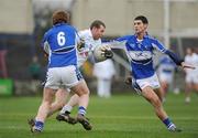 1 February 2009; Ronan Sweeney, Kildare, in action against Ger Reddin, 6, and Brendan Quigley, Laois. Allianz National Football League, Division 2, Round 1, Laois v Kildare. O'Moore Park, Portlaoise, Co. Laois. Picture credit: Stephen McCarthy / SPORTSFILE