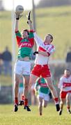1 February 2009; Ronan McGarrity, Mayo, in action against Fergal Doherty, Derry. Allianz National Football League, Division 1, Round 1, Mayo v Derry, James Stephen's Park, Ballina, Co. Mayo. Picture credit: Ray Ryan / SPORTSFILE