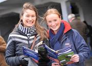 2 February 2009; Kate Fleming, right, with Gillian Hegarty, both from Cork, study the form at the National Coursing Meeting. Powerstown Park, Clonmel, Co. Tipperary. Picture credit: David Maher / SPORTSFILE