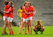 22 August 2015; Armagh's, from left, Sharon Reel, Kelly Mallon, Fionnuala McKeon and Aimee Mackin celebrate, as Donegal's Niamh McLaghlin is dejected after the game. TG4 Ladies Football All-Ireland Senior Championship, Quarter-Final, Donegal v Armagh. St Tiernach's Park, Clones, Co. Monaghan. Picture credit: Piaras Ó Mídheach / SPORTSFILE