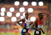 22 August 2015; Mo Farah of Great Britain, left, and Paul Kipngetich Tanui of Kenya during the final of the Men's 10,000m event. IAAF World Athletics Championships Beijing 2015 - Day 1, National Stadium, Beijing, China. Picture credit: Stephen McCarthy / SPORTSFILE