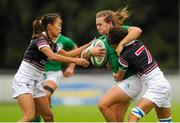 22 August 2015; Katie Fitzhenry, Ireland, is tackled by Sau Yan Kwong and Pou Fan Lai, Hong Kong. Women's Sevens Rugby Tournament, Pool C, Ireland v Hong Kong. UCD, Belfield, Dublin. Picture credit: Seb Daly / SPORTSFILE