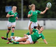 22 August 2015; Louise Galvin, Ireland, off-loads to team mate Alison Miller after being tackled by Wai Sum Sham, Hong Kong. Women's Sevens Rugby Tournament, Pool C, Ireland v Hong Kong. UCD, Belfield, Dublin. Picture credit: Seb Daly / SPORTSFILE