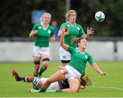 22 August 2015; Louise Galvin, Ireland, off-loads to team mate Alison Miller after being tackled by Wai Sum Sham, Hong Kong. Women's Sevens Rugby Tournament, Pool C, Ireland v Hong Kong. UCD, Belfield, Dublin. Picture credit: Seb Daly / SPORTSFILE
