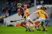 22 August 2015; Conor McDonald, Wexford, in action against Maoi Connolly, left, and Michael Dudley, Antrim. Bord Gáis Energy GAA Hurling All Ireland U21 Championship, Semi-Final, Wexford v Antrim. Semple Stadium, Thurles, Co. Tipperary. Picture credit: Dáire Brennan / SPORTSFILE