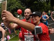 23 August 2015  Peter O'Sullivan and Nadya Bhettay, both Vodafone, at the finish line after completing the Vodafone Dublin City Triathlon 2015. Phoenix Park, Dublin. Picture credit: David Maher / SPORTSFILE