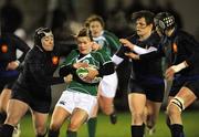 6 February 2009; Lynne Cantwell, Ireland, is tackled by Cyrielle Bouisset, left, Stephanie Loyer and Claire Canal, right, France. Women's 6 Nations Championship, Ireland v France. Ashbourne RFC, Co. Meath. Picture credit: Brian Lawless / SPORTSFILE