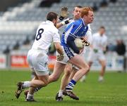 1 February 2009; Pauric Clancy, Laois, in action against Daryl Flynn, left, and Ronan Sweeney, Kildare. Allianz GAA National Football League, Division 2, Round 1, Laois v Kildare. O'Moore Park, Portlaoise, Co. Laois. Picture credit: Stephen McCarthy / SPORTSFILE