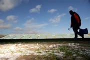 8 February 2009; A small amount of snow remains on the side of the pitch as groundsman Ger O'Neill places the flags ahead of the match. Allianz GAA National Hurling League, Division 1, Round 1, Limerick v Clare, Gaelic Grounds, Limerick. Picture credit: Brian Lawless / SPORTSFILE