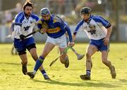 8 February 2009; Benny Dunne, Tipperary, is tackled by Dan Shanahan, left, and Jack Kennedy, Waterford. Allianz GAA National Hurling League, Division 1, Round 1, Waterford v Tipperary, Walsh Park, Waterford. Picture credit: Matt Browne / SPORTSFILE