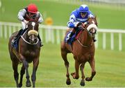 23 August 2015; Cailin Mor, left, with Sean Corby up, race alongside Chillie Billie, with Ross Coakley up, who finished second, on their way to winning the Luke & Nellie Comer Apprentice Handicap. Horse Racing from the Curragh. Curragh, Co. Kildare. Picture credit: Cody Glenn / SPORTSFILE