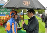23 August 2015; Seamie Heffernan talks to trainer Aidan O'Brien after riding Found to victory in the Kilfrush Stud Royal Whip Stakes. Horse Racing from the Curragh. Curragh, Co. Kildare. Picture credit: Cody Glenn / SPORTSFILE