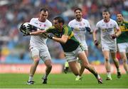 23 August 2015; Cathal McCarron, Tyrone, is tackled by Anthony Maher, Kerry. GAA Football All-Ireland Senior Championship, Semi-Final, Kerry v Tyrone. Croke Park, Dublin. Picture credit: Ramsey Cardy / SPORTSFILE