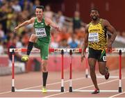 23 August 2015; Thomas Barr of Ireland, left, and Annsert Whyte of Jamaica clear the final hurdle during their semi-final of the Men's 400m hurdles event. IAAF World Athletics Championships Beijing 2015 - Day 2, National Stadium, Beijing, China. Picture credit: Stephen McCarthy / SPORTSFILE