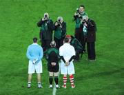 31 January 2009; Tyrone captain Ryan McMenamin and Dublin captain David Henry have their picture taken alongside referee Marty Duffy. Allianz National Football League, Division 1, Round 1, Dublin v Tyrone. Croke Park, Dublin. Picture credit: Stephen McCarthy / SPORTSFILE