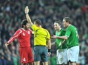 11 February 2009; Republic of Ireland's Robbie Keane and Richard Dunne remonstrate with referee Jouni Hyytia after he disallowed a Keith Andrews' goal for offside. 2010 FIFA World Cup Qualifier, Republic of Ireland v Georgia. Croke Park, Dublin. Picture credit: David Maher / SPORTSFILE