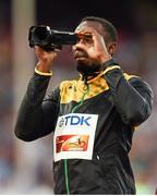 24 August 2015; Usain Bolt of Jamaica uses a video camera at the podium before collecting his Men's 100m gold medal. IAAF World Athletics Championships Beijing 2015 - Day 3, National Stadium, Beijing, China. Picture credit: Stephen McCarthy / SPORTSFILE