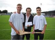22 August 2015; Calvin Carrol, left, and Neil Byrnes, from the Patrickswell GAA Club, Co. Limerick, receive their prize from Marty Morrissey after winning the half time crossbar challenge. Bord Gáis Energy GAA Hurling All Ireland U21 Championship, Semi-Final, Limerick v Antrim. Semple Stadium, Thurles, Co. Tipperary. Picture credit: Dáire Brennan / SPORTSFILE