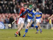 14 February 2009; Shane Maher, Tipperary, in action against Tadhg Og O Murchu, Cork. Allianz GAA National Hurling League, Division 1 Round 2, Tipperary v Cork, Semple Stadium, Thurles. Picture credit: Pat Murphy / SPORTSFILE