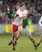 15 February 2009 Enda McGiinley, Tyrone, in action against David Moran, Kerry. Allianz National Football League, Division 1, Round 2, Tyrone v Kerry, Healy Park, Omagh, Co. Tyrone. Picture credit: Oliver McVeigh / SPORTSFILE
