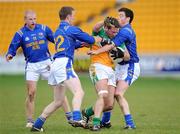 15 February 2009; Shane Sullivan, Offaly, in action against, from left, Padraig Berry, Declan Farrell, and Willie Skelly, Longford. Allianz National Football League, Division 3, Round 2, Offaly v Longford, O'Connor Park, Tullamore, Co. Offaly. Picture credit: Brian Lawless / SPORTSFILE