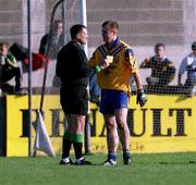 14 October 2000; Dessie Farrell of Na Fianna is shown a yellow card by referee John Rutherford during the Evening Herald Dublin Senior Football Championship Final match between Na Fianna and Kilmacud Crokes at Parnell Park in Dublin. Photo by Brendan Moran/Sportsfile