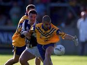 14 October 2000; Brian McManus of Na Fianna in action against Mick O'Keeffe of Kilmacud Crokes during the Evening Herald Dublin Senior Football Championship Final match between Na Fianna and Kilmacud Crokes at Parnell Park in Dublin. Photo by Brendan Moran/Sportsfile