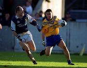 14 October 2000; Senan Connell of Na Fianna in action against John O'Donovan of Kilmacud Crokes during the Evening Herald Dublin Senior Football Championship Final match between Na Fianna and Kilmacud Crokes at Parnell Park in Dublin. Photo by Brendan Moran/Sportsfile