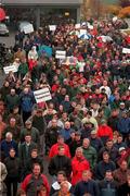 17 October 2000; A demonstration was held at The Curragh Racecourse today to highlight the fact that the Turf Club stands in the way of securing the future for racing. Attendees included stable and stud employees, trainers, jockeys, owners, breeders, farriers and racecourse representatives. Pictured are attendees during the protest at The Curragh Racecourse in Kildare. Photo by Damien Eagers/Sportsfile