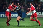 13 October 2000; Denis Hickie of Leinster is tackled by Stuart Legg, left, and Nicolas Couttet of Biarritz during the Heineken Cup Pool 1 match between Leinster and Biarritz at Donnybrook Stadium in Dublin. Photo by Damien Eagers/Sportsfile