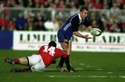 21 October 2000; Kevin Maggs of Bath is tackled by John Kelly of Munster during the Heineken Cup Pool 4 match between Munster and Bath at Thomond Park in Limerick. Photo by Damien Eagers/Sportsfile