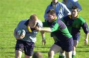 21 October 2000; Des Dillion of UCD is tackled by Joey Callaghan of Ballynahinch during the All-Ireland League Division 2 match between UCD and Ballynahinch at Belfield Park in Dublin. Photo by Ray McManus/Sportsfile