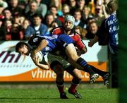 21 October 2000; Matt Perry of Bath is tackled by Mike Mullins of Munster during the Heineken Cup Pool 4 match between Munster and Bath at Thomond Park in Limerick. Photo by Damien Eagers/Sportsfile