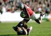 21 October 2000; Mike Mullins of Munster escapes the tackle of a Bath opponent during the Heineken Cup Pool 4 match between Munster and Bath at Thomond Park in Limerick. Photo by Damien Eagers/Sportsfile